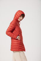 Women’s insulated hooded parka in rust red, designed for warmth and comfort in South Africa’s winter season — Rust Classic Parka™