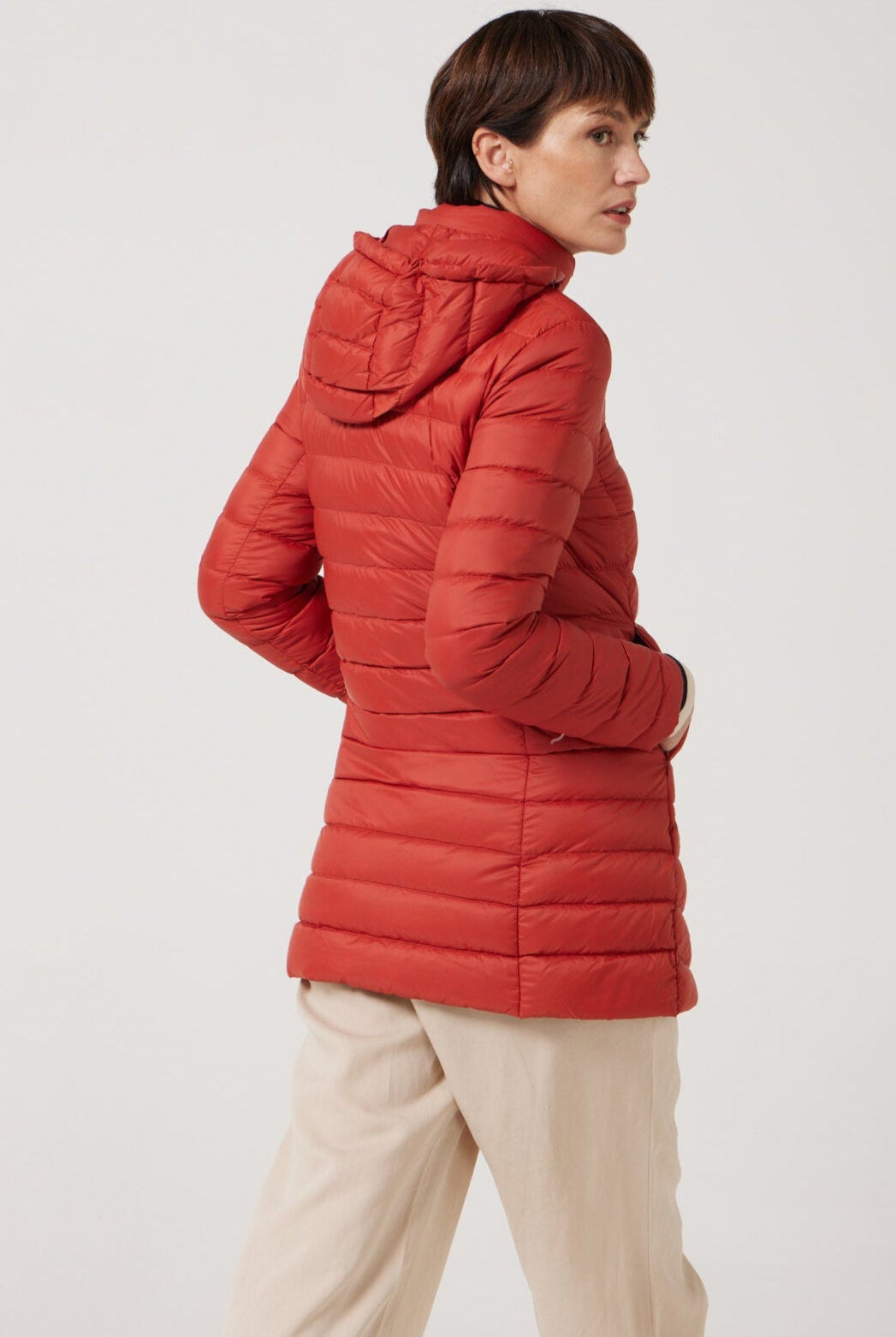 Women’s insulated hooded parka in rust red, designed for warmth and comfort in South Africa’s winter season — Rust Classic Parka™