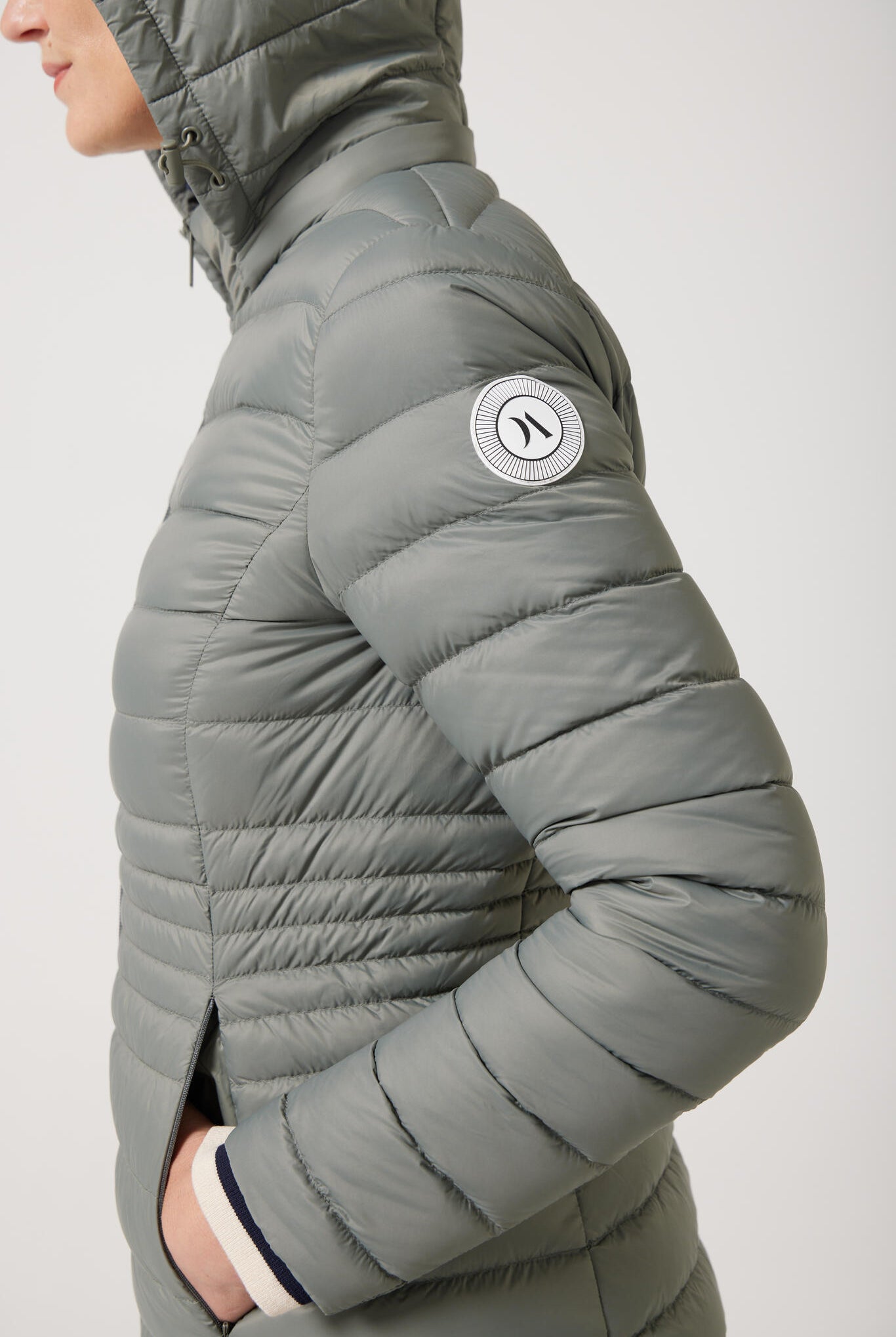 Women’s insulated midi-length hooded parka in sage green, designed for warmth and comfort in South Africa’s winter season — Sage Midi Parka™