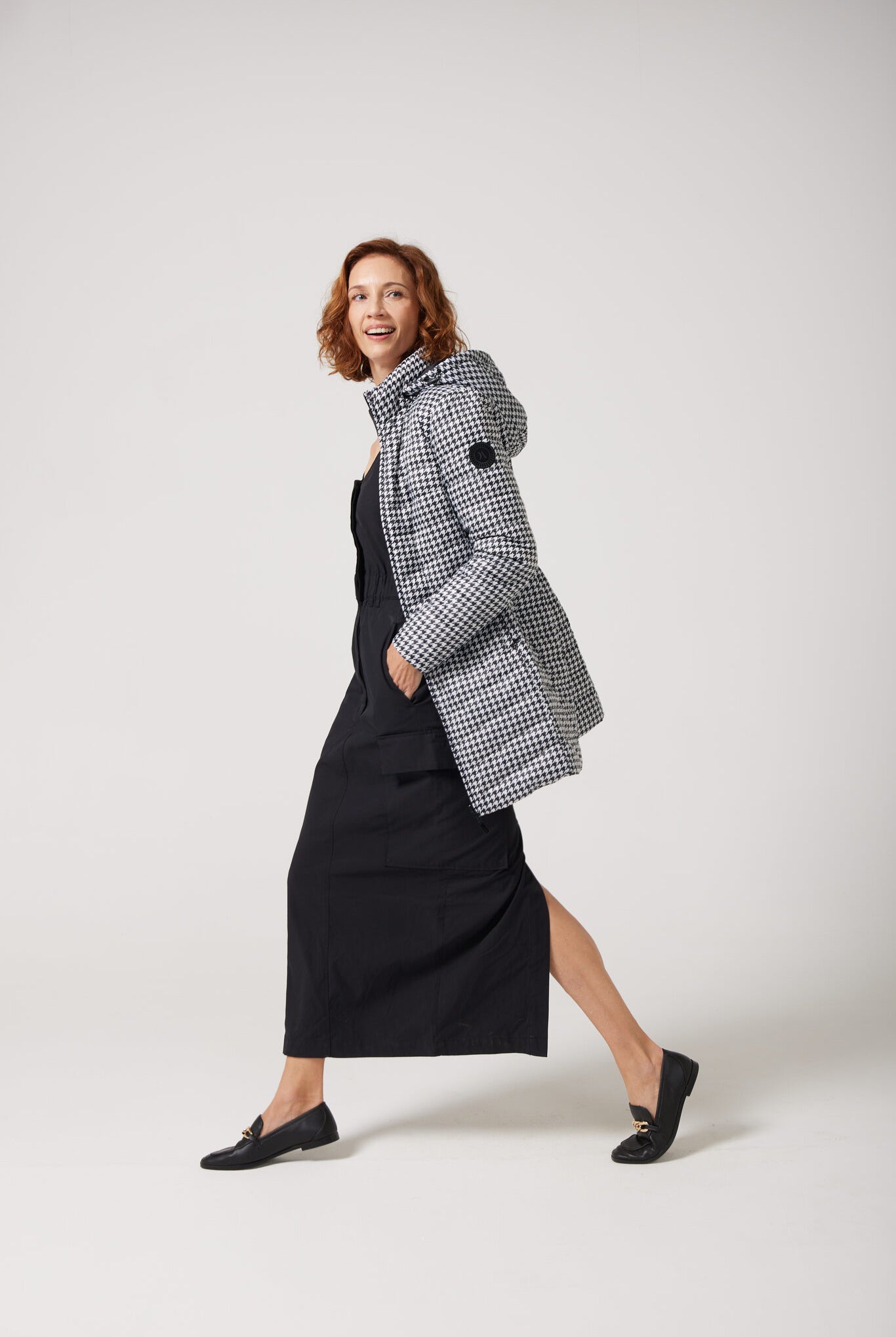 Women’s insulated reversible hooded parka in houndstooth print and midnight black, designed for warmth and comfort in South Africa’s winter season — Midnight x Houndstooth Classic Parka™