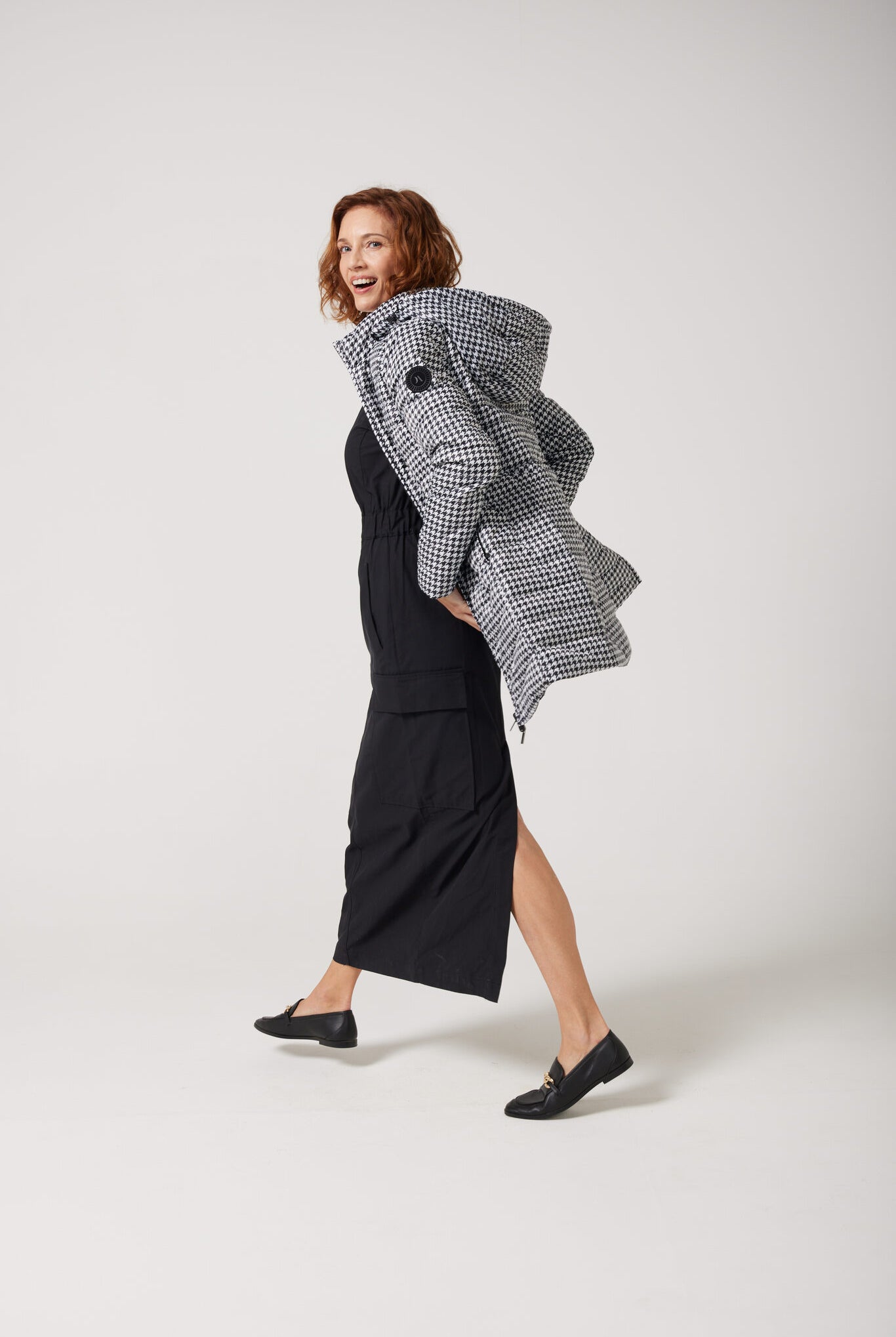 Women’s insulated reversible hooded parka in houndstooth print and midnight black, designed for warmth and comfort in South Africa’s winter season — Midnight x Houndstooth Classic Parka™