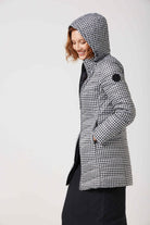 Women’s insulated reversible hooded parka in houndstooth print and midnight black, designed for warmth and comfort in South Africa’s winter season — Midnight x Houndstooth Classic Parka™