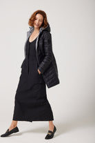 Women’s insulated reversible hooded parka in houndstooth print and midnight black, designed for warmth and comfort in South Africa’s winter season — Midnight x Houndstooth Classic Parka™