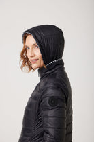 Women’s insulated reversible hooded parka in houndstooth print and midnight black, designed for warmth and comfort in South Africa’s winter season — Midnight x Houndstooth Classic Parka™