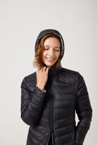 Women’s insulated reversible hooded parka in houndstooth print and midnight black, designed for warmth and comfort in South Africa’s winter season — Midnight x Houndstooth Classic Parka™