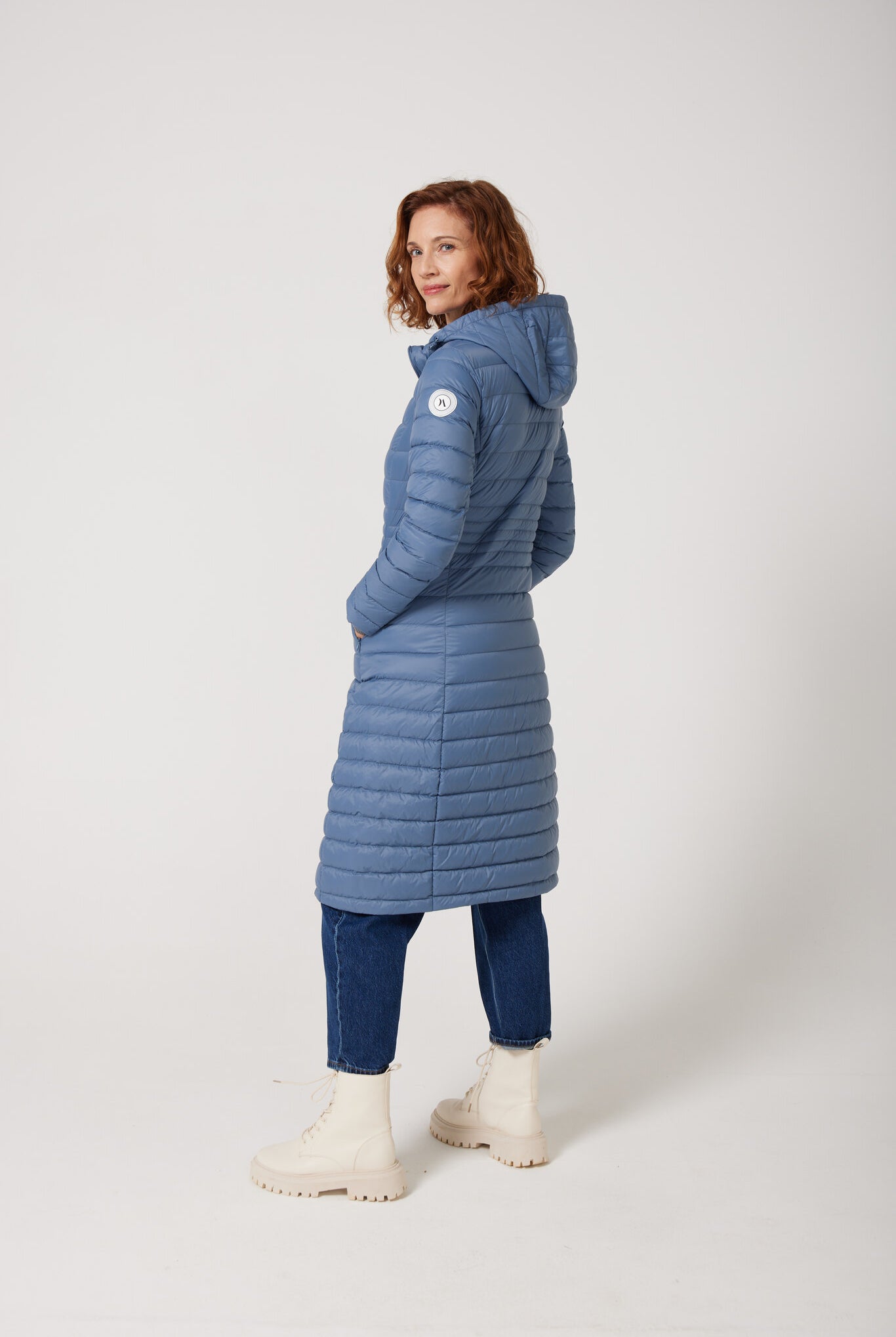 Women’s insulated ultra-length hooded parka in sky blue, designed for extra warmth and comfort in South Africa’s winter season — Vista Ultra Parka™