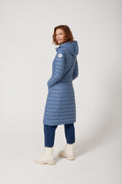 Women’s insulated ultra-length hooded parka in sky blue, designed for extra warmth and comfort in South Africa’s winter season — Vista Ultra Parka™