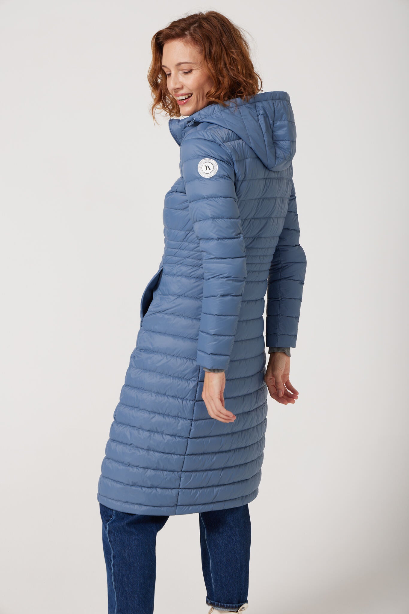 Women’s insulated ultra-length hooded parka in sky blue, designed for extra warmth and comfort in South Africa’s winter season — Vista Ultra Parka™