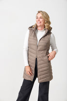 Chai Longline Gilet™ — women’s sleeveless quilted puffer vest in neutral chai brown, longline design with hood, ideal for layering in South Africa