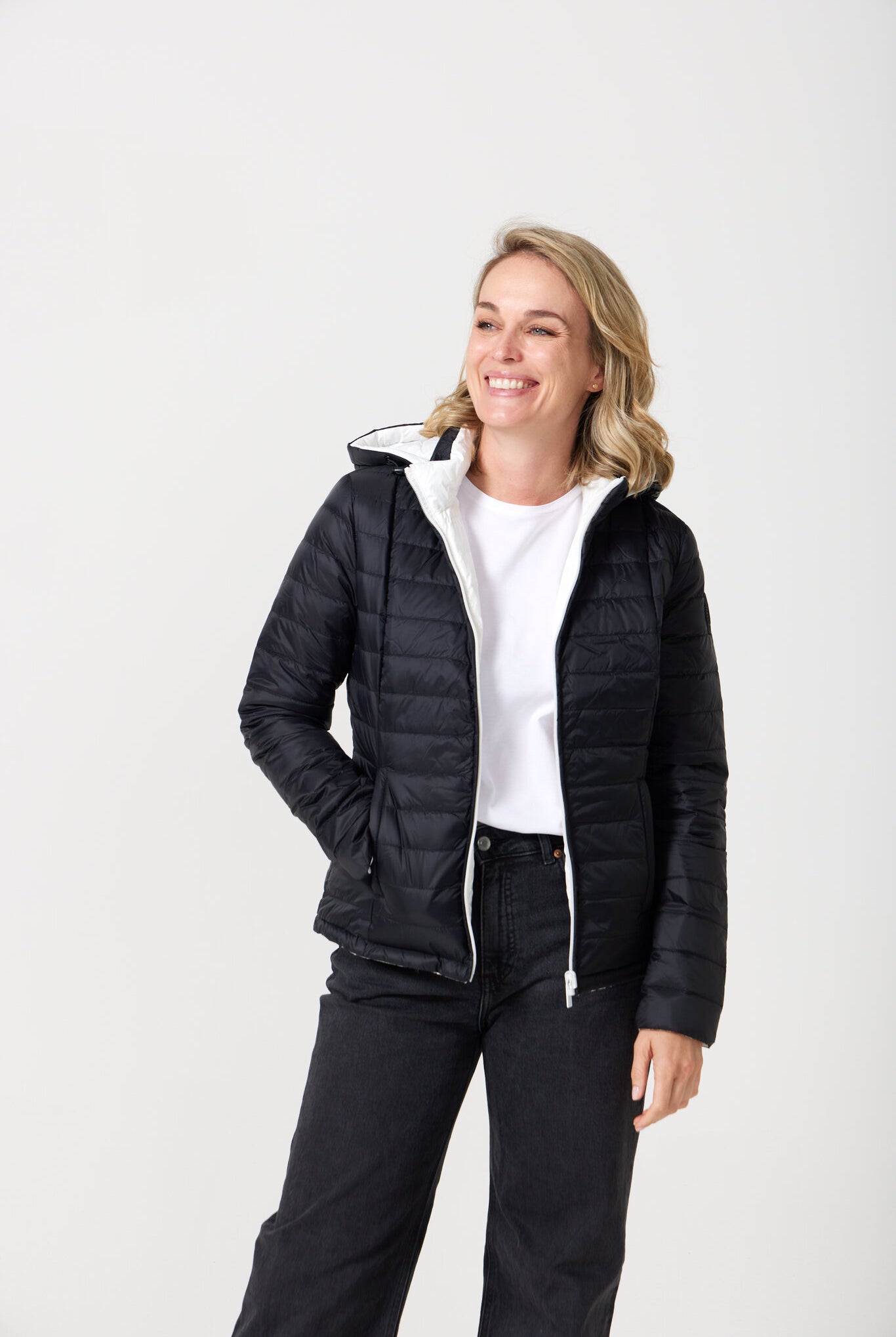 Women’s reversible puffer jacket in white and black, lightweight and warm for layering in South Africa — Midnight x Salt Classic Jacket™