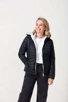 Women’s reversible puffer jacket in white and black, lightweight and warm for layering in South Africa — Midnight x Salt Classic Jacket™