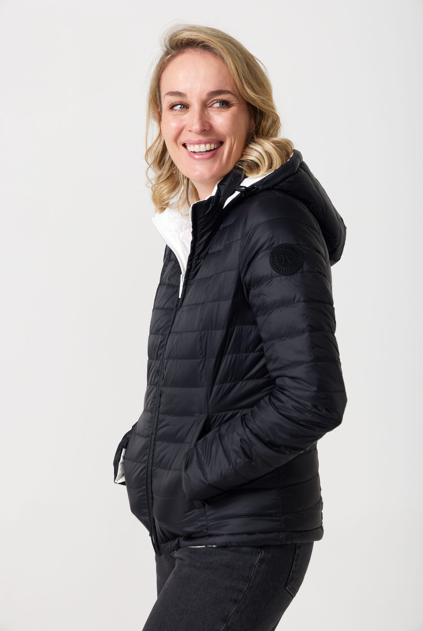 Women’s reversible puffer jacket in white and black, lightweight and warm for layering in South Africa — Midnight x Salt Classic Jacket™