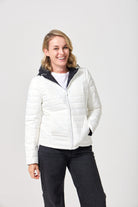Women’s reversible puffer jacket in white and black, lightweight and warm for layering in South Africa — Midnight x Salt Classic Jacket™