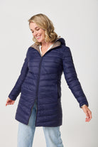 Toffee x Navy Classic Parka™ reversible insulated hooded parka in navy blue and toffee, designed for warmth and versatility in South Africa’s winter season