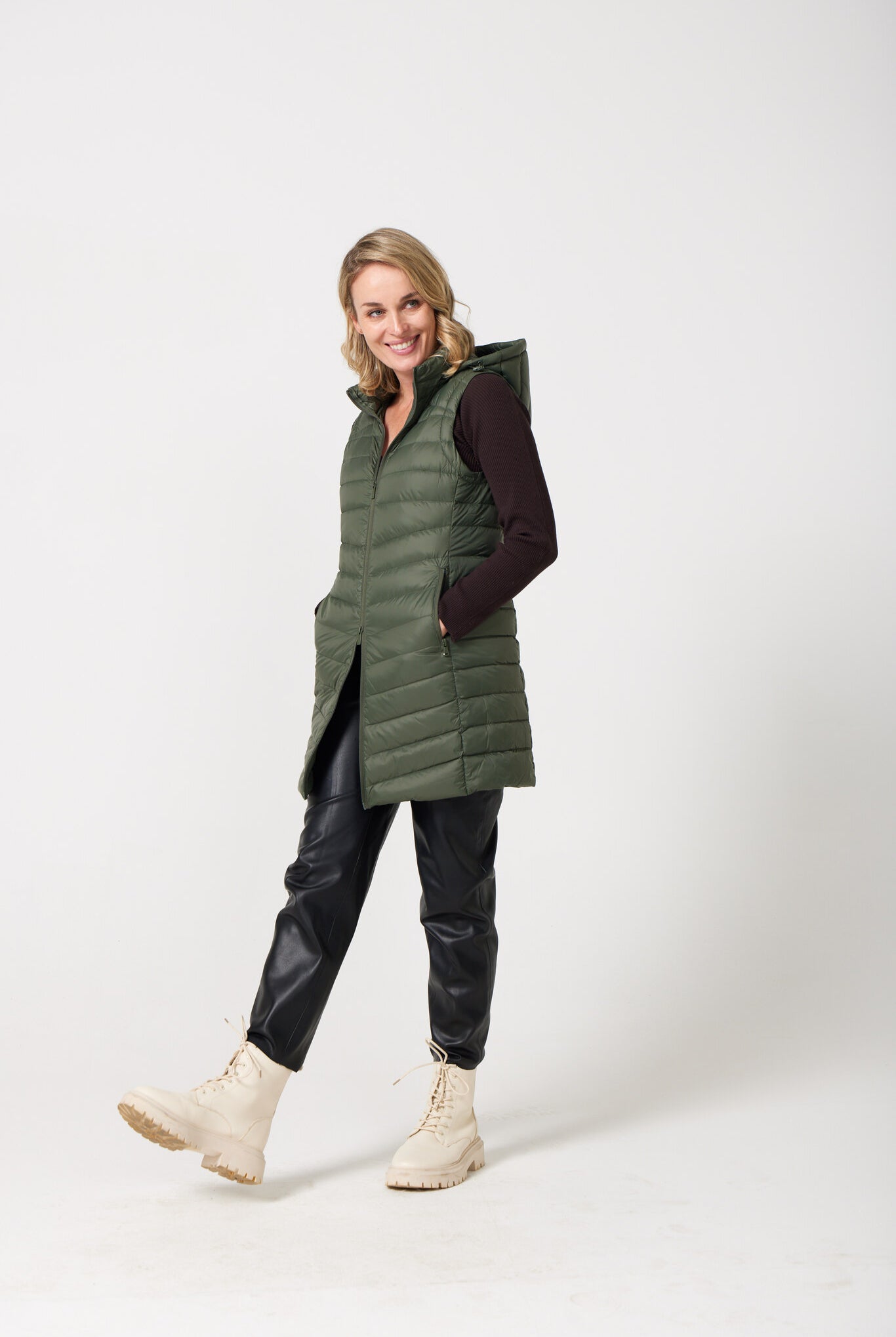 Sage Longline Gilet™ — women’s sleeveless gilet in sage green, extra length with hood, versatile for layering in winter an essential in South Africa
