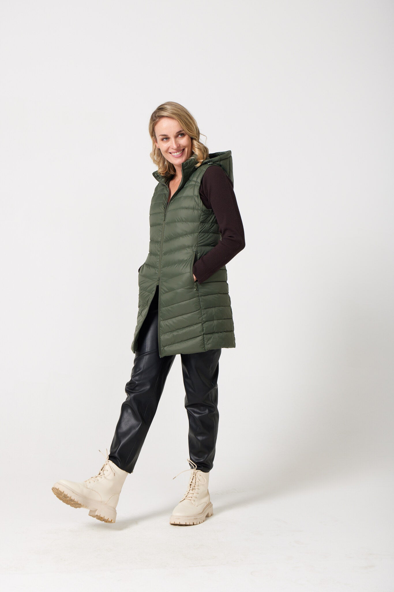 Sage Longline Gilet™ — women’s sleeveless gilet in sage green, extra length with hood, versatile for layering in winter an essential in South Africa