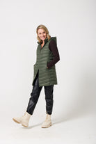 Sage Longline Gilet™ — women’s sleeveless gilet in sage green, extra length with hood, versatile for layering in winter an essential in South Africa