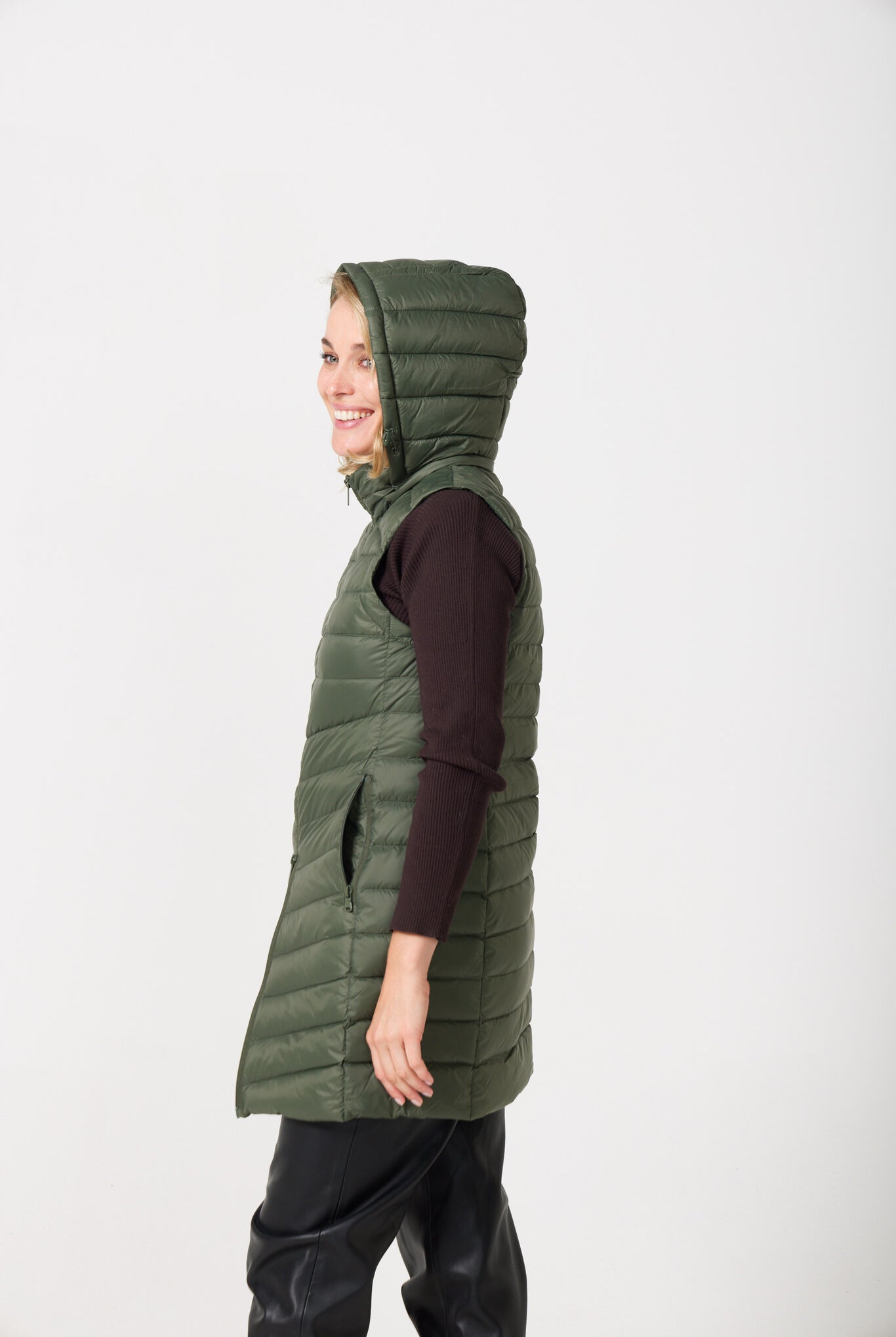 Sage Longline Gilet™ — women’s sleeveless gilet in sage green, extra length with hood, versatile for layering in winter an essential in South Africa
