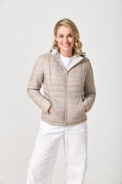 Women’s Sand x Leopard Classic Jacket™ reversible lightweight puffer in soft beige and subtle leopard print, versatile jacket for layering in South Africa