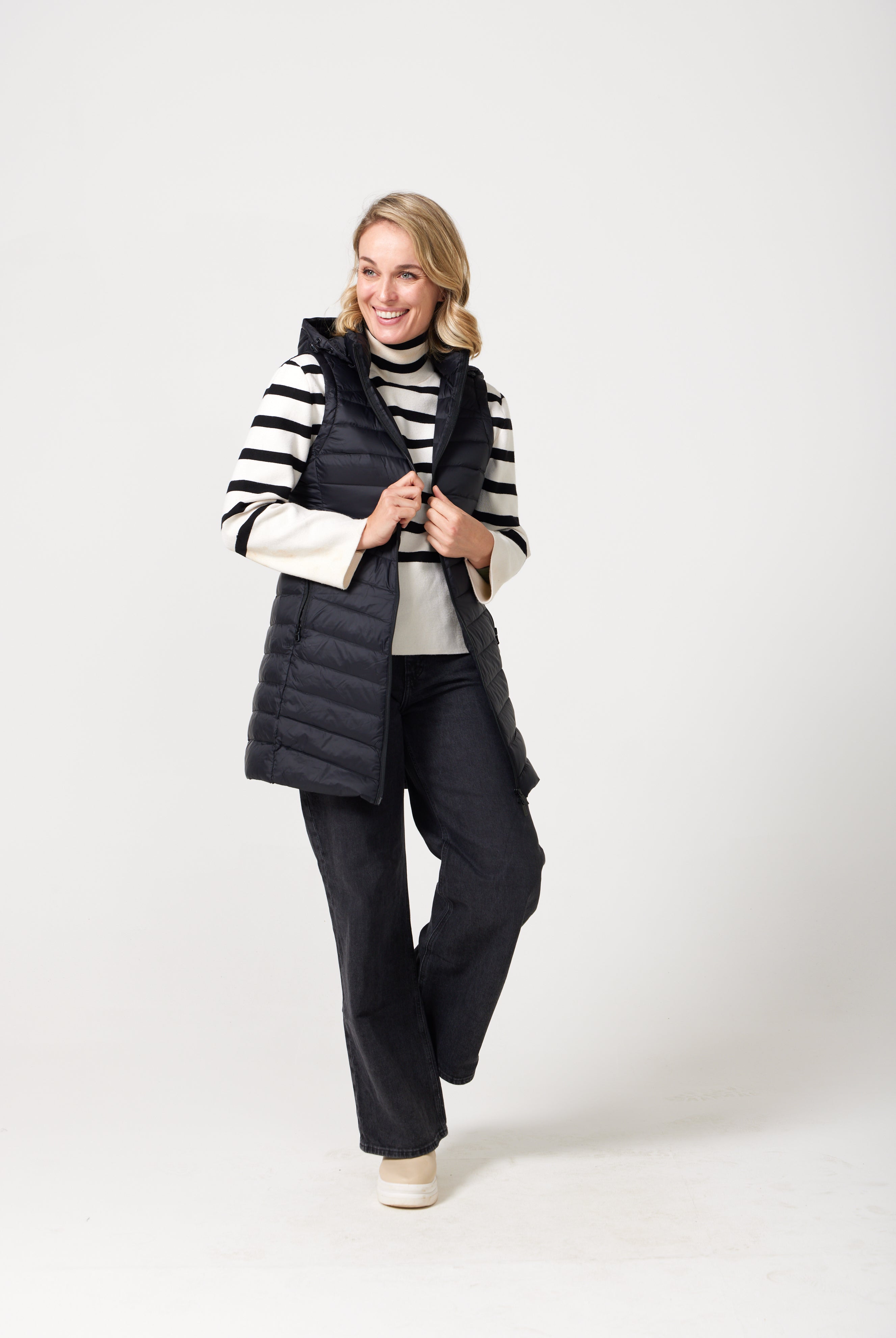 Midnight Longline Gilet™ — women’s sleeveless gilet in black, longline cut with hood, versatile layering piece for winter in South Africa.