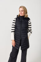 Midnight Longline Gilet™ — women’s sleeveless gilet in black, longline cut with hood, versatile layering piece for winter in South Africa.