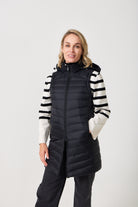 Midnight Longline Gilet™ — women’s sleeveless gilet in black, longline cut with hood, versatile layering piece for winter in South Africa.