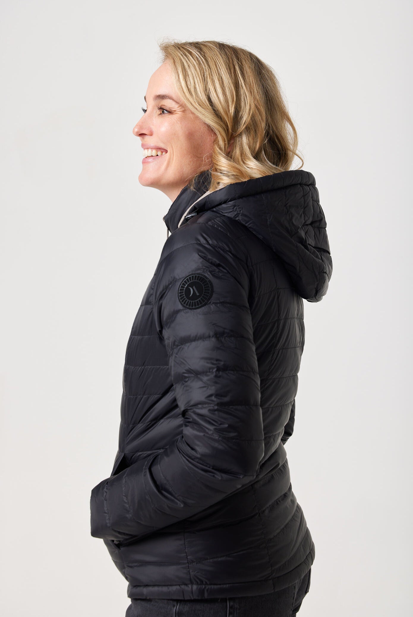 Women’s Ebony x Ivory Classic Jacket™ reversible lightweight puffer in neutral beige and black, versatile outerwear for layering in South Africa