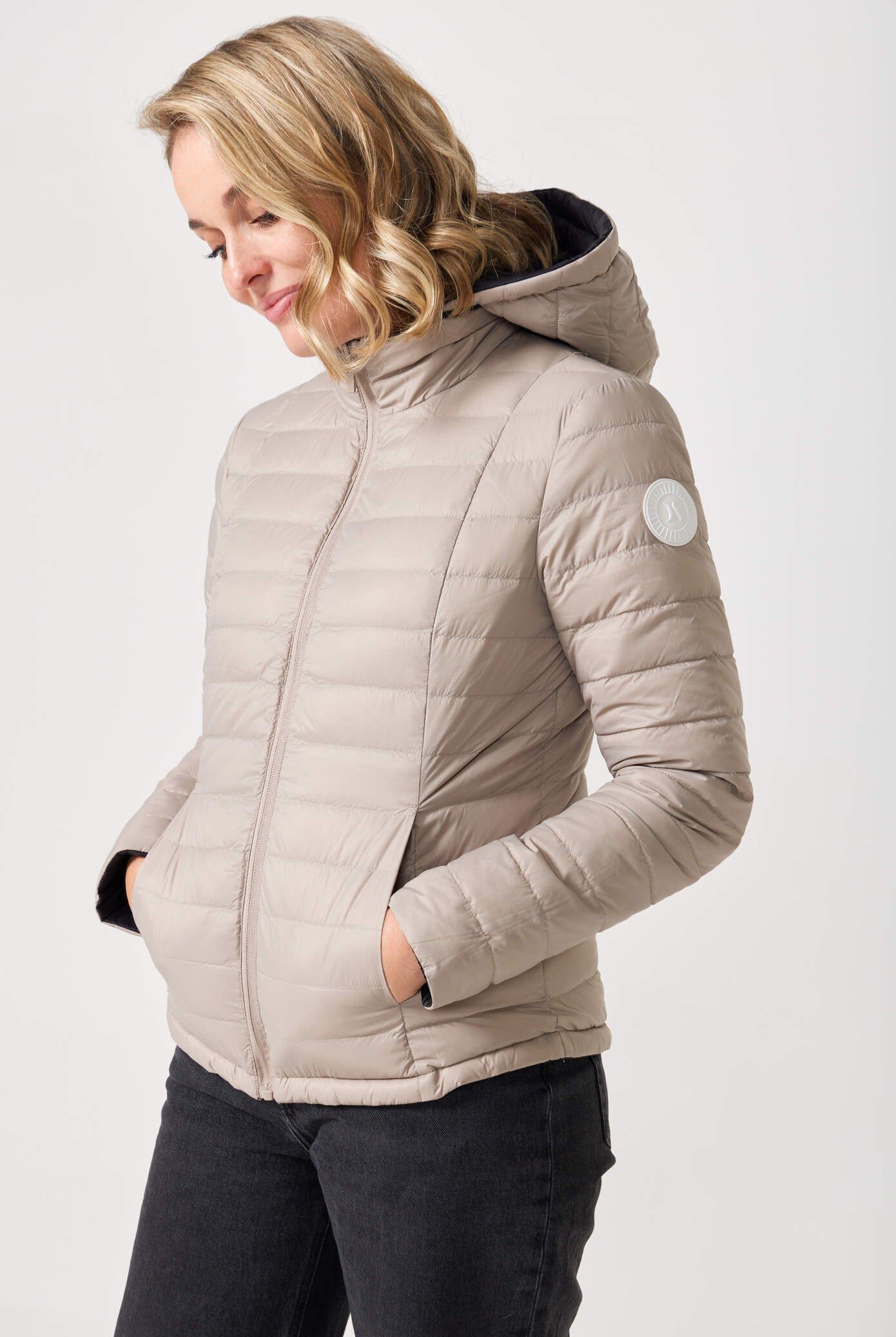Women’s Ebony x Ivory Classic Jacket™ reversible lightweight puffer in neutral beige and black, versatile outerwear for layering in South Africa