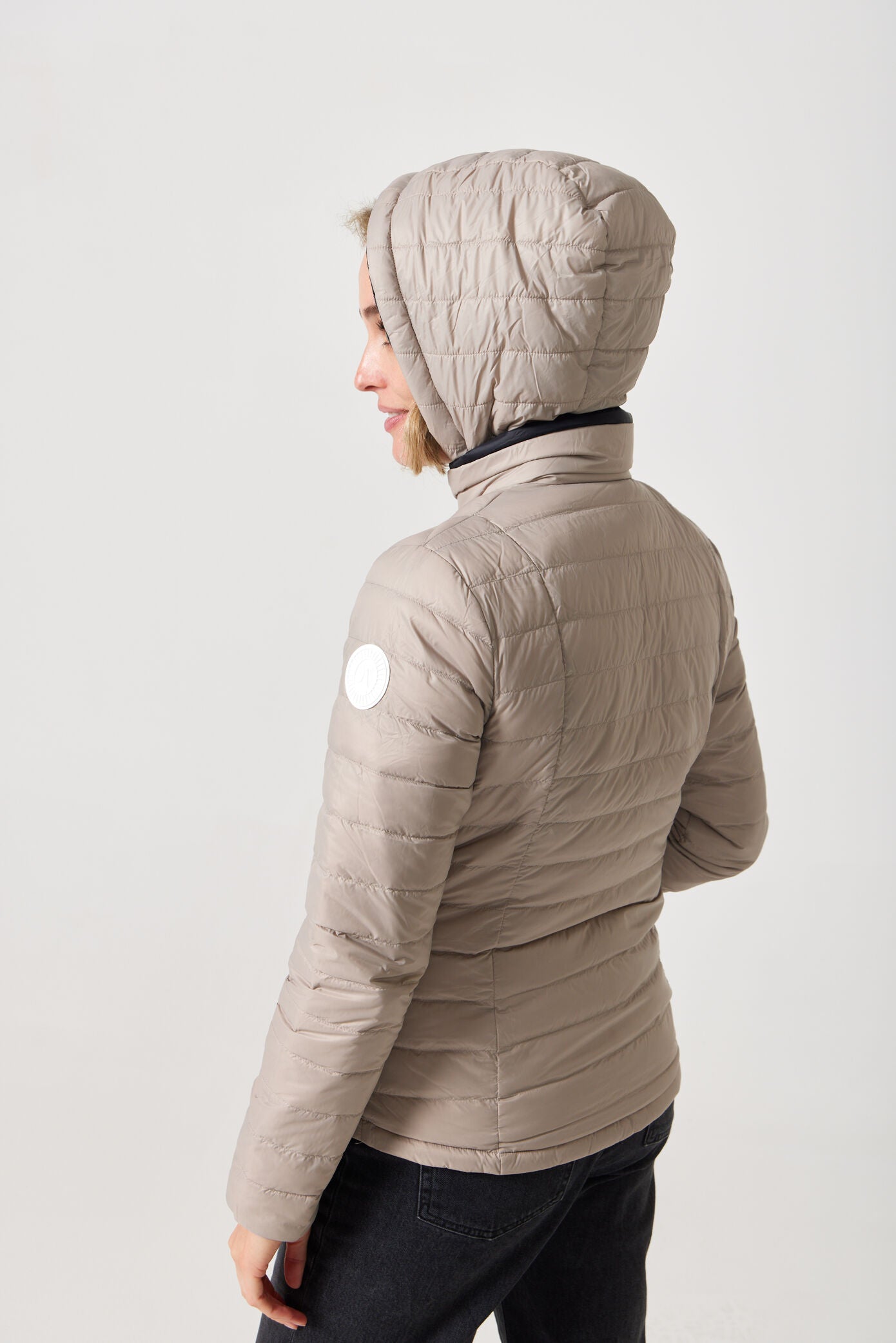Women’s Ebony x Ivory Classic Jacket™ reversible lightweight puffer in neutral beige and black, versatile outerwear for layering in South Africa