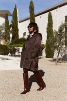 Truffle Haze raincoat in dark brown, lightweight hooded waterproof raincoat ideal for South Africa’s rainy season and wet climate