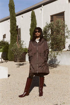 Truffle Haze raincoat in dark brown, lightweight hooded waterproof raincoat ideal for South Africa’s rainy season and wet climate