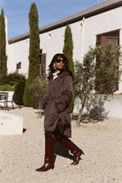 Truffle Haze raincoat in dark brown, lightweight hooded waterproof raincoat ideal for South Africa’s rainy season and wet climate