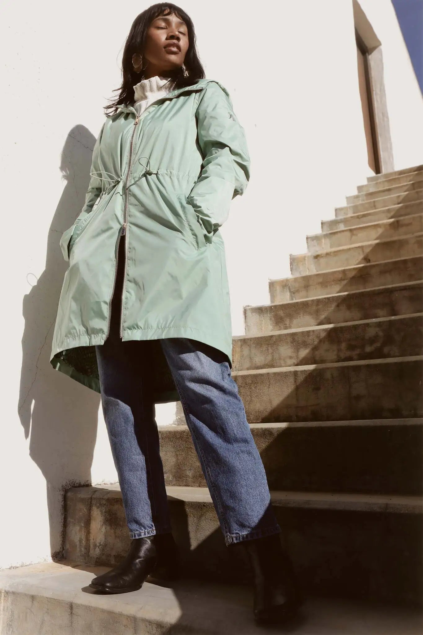 Madame Verde Vol 1 raincoat in light green with hood, stylish waterproof jacket for rainy days in South Africa