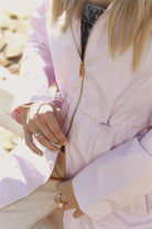 Rosewater Mist raincoat in pastel pink with hood, lightweight waterproof jacket for stylish rainy days in South Africa