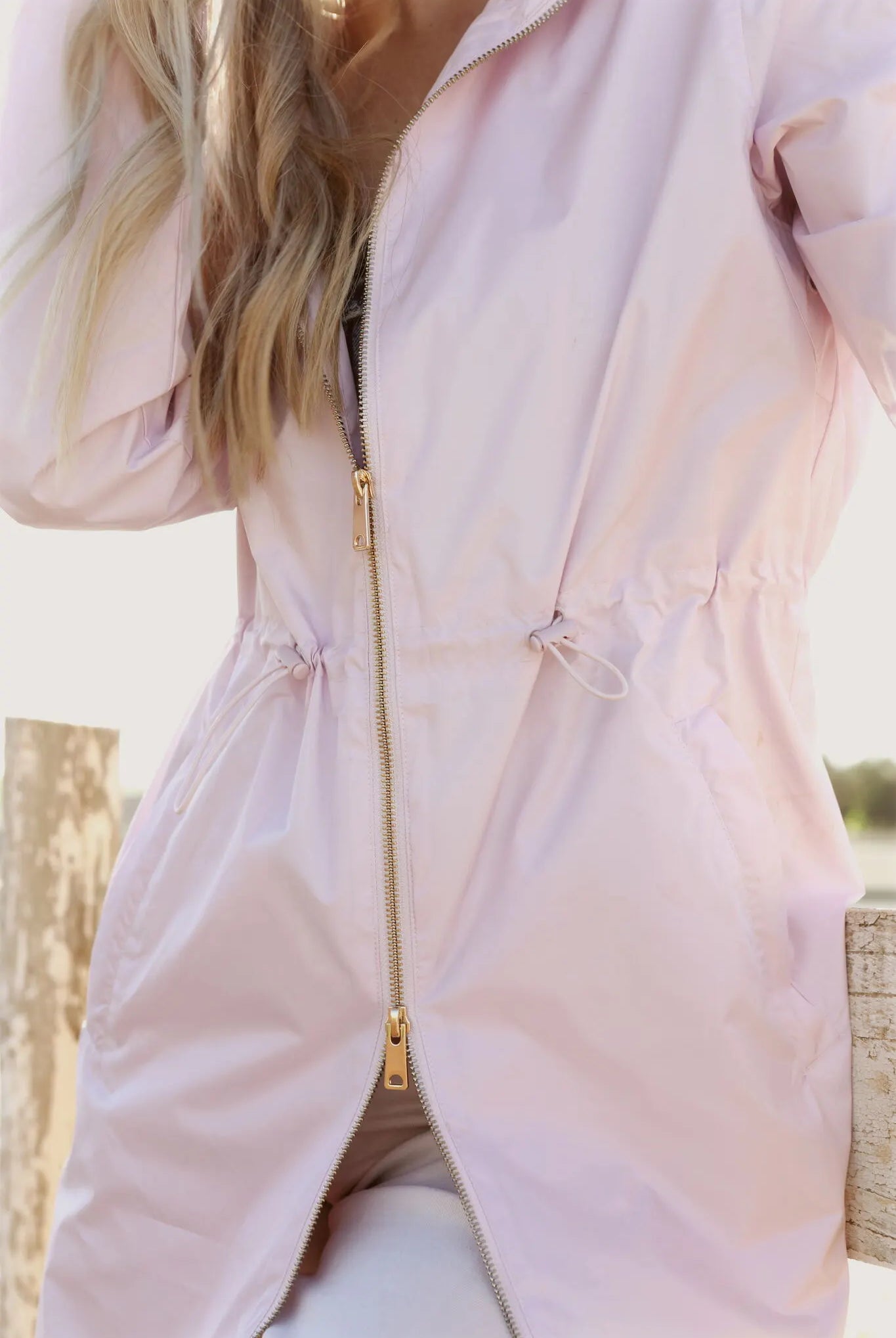 Rosewater Mist raincoat in pastel pink with hood, lightweight waterproof jacket for stylish rainy days in South Africa