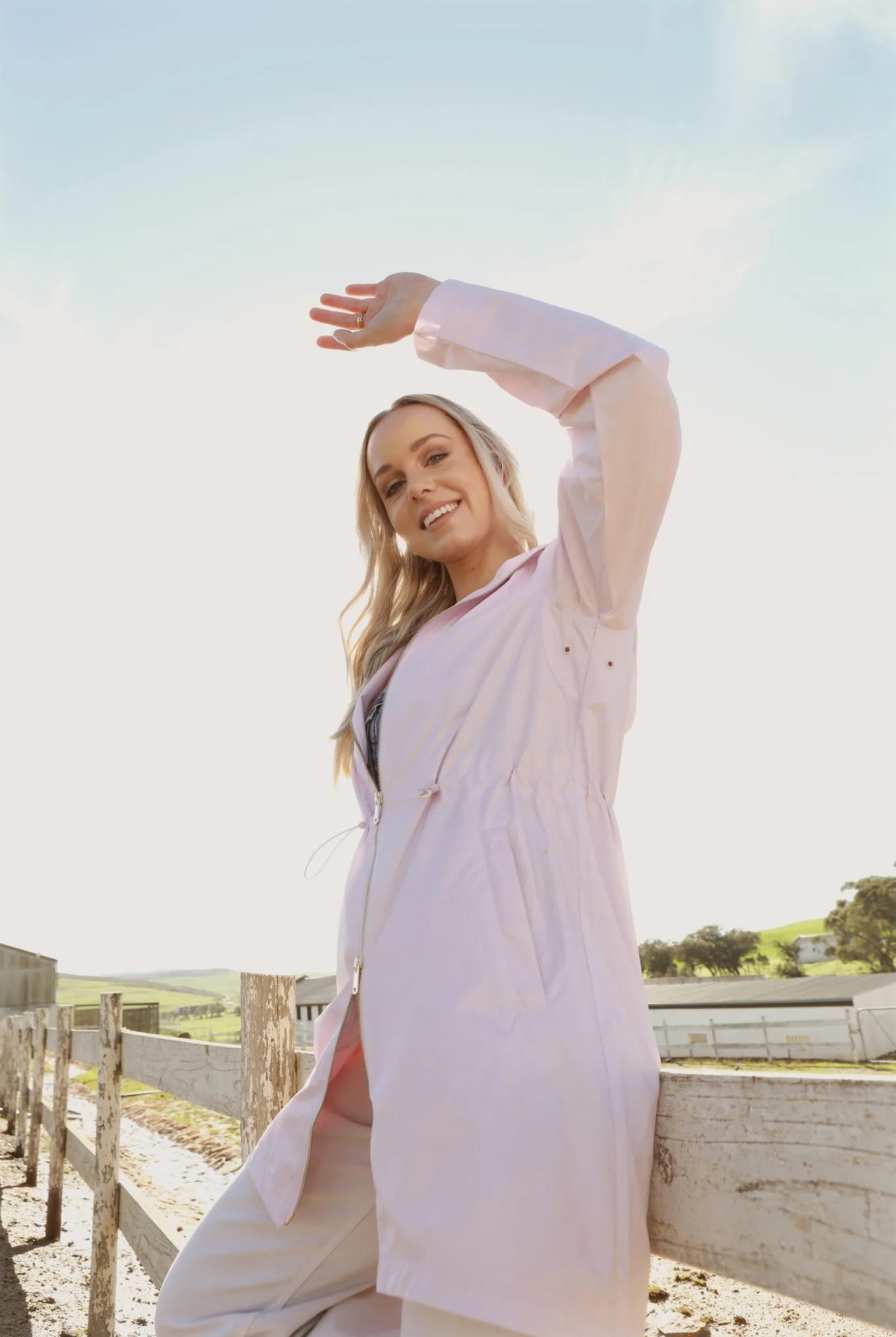 Rosewater Mist raincoat in pastel pink with hood, lightweight waterproof jacket for stylish rainy days in South Africa