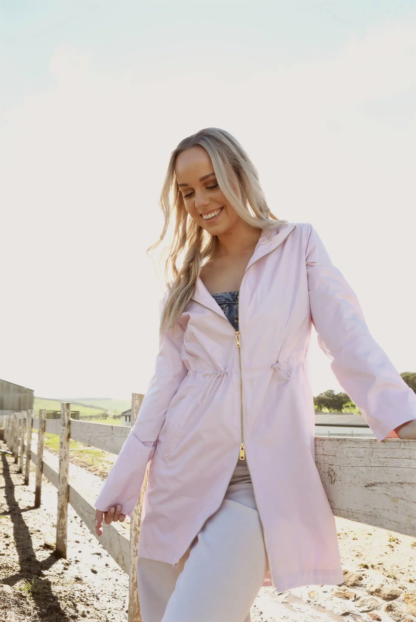 Rosewater Mist raincoat in pastel pink with hood, lightweight waterproof jacket for stylish rainy days in South Africa
