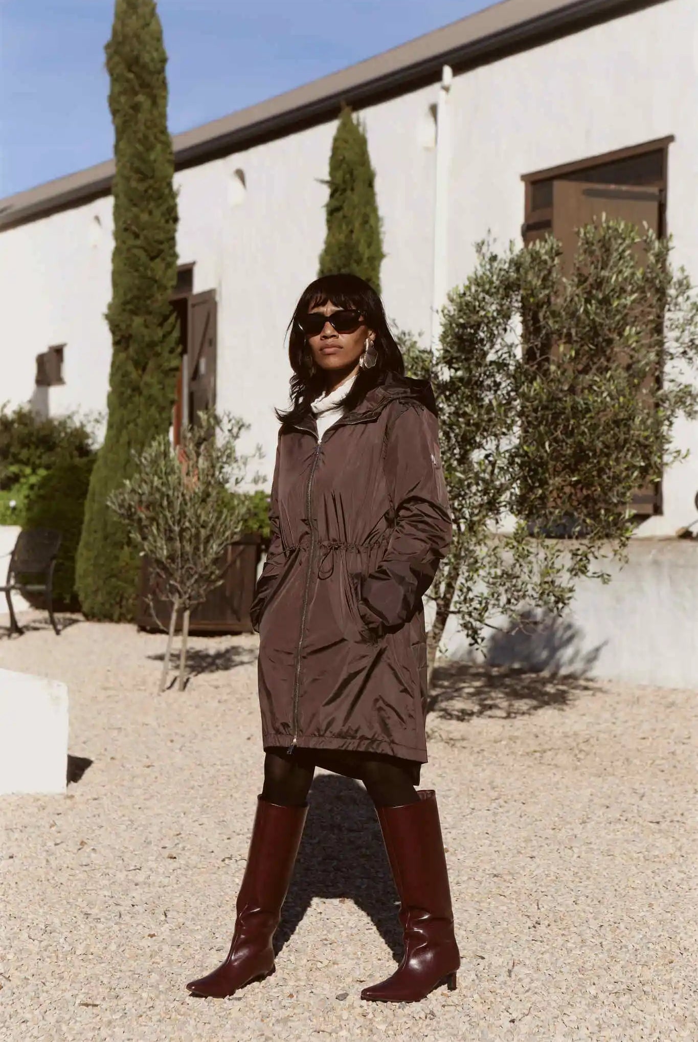 Truffle Haze raincoat in dark brown, lightweight hooded waterproof raincoat ideal for South Africa’s rainy season and wet climate