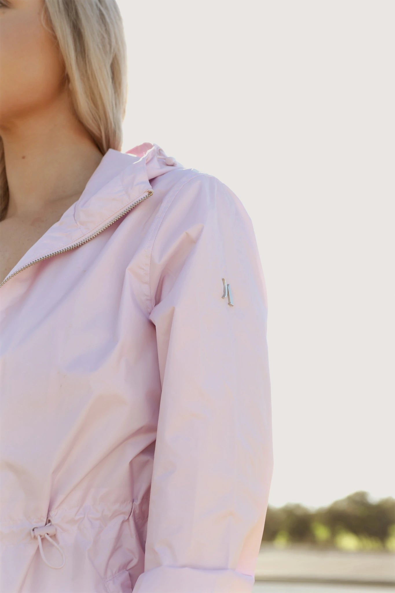 Rosewater Mist raincoat in pastel pink with hood, lightweight waterproof jacket for stylish rainy days in South Africa