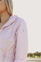 Rosewater Mist raincoat in pastel pink with hood, lightweight waterproof jacket for stylish rainy days in South Africa