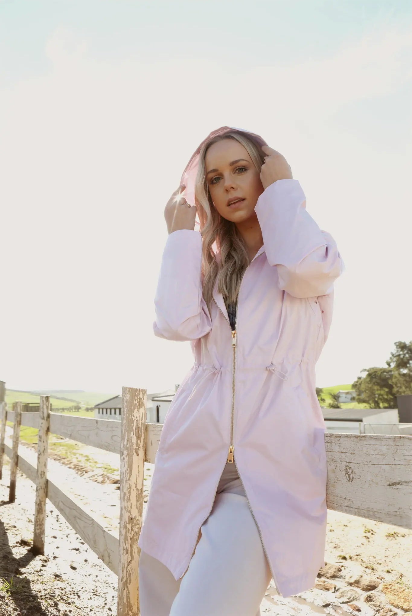 Rosewater Mist raincoat in pastel pink with hood, lightweight waterproof jacket for stylish rainy days in South Africa