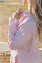 Rosewater Mist raincoat in pastel pink with hood, lightweight waterproof jacket for stylish rainy days in South Africa