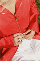 Lipstick Crush No 5 raincoat in bold red, lightweight hooded waterproof raincoat perfect for South Africa’s rainy climate