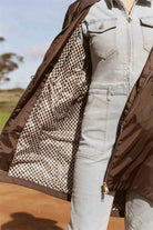 Truffle Haze raincoat in dark brown, lightweight hooded waterproof raincoat ideal for South Africa’s rainy season and wet climate