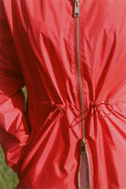 Lipstick Crush No 5 raincoat in bold red, lightweight hooded waterproof raincoat perfect for South Africa’s rainy climate