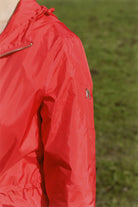 Lipstick Crush No 5 raincoat in bold red, lightweight hooded waterproof raincoat perfect for South Africa’s rainy climate