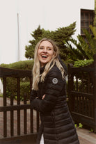 Women’s insulated ultra-length hooded parka in midnight black, designed for extra warmth and comfort in South Africa’s winter season — Midnight Ultra Parka™