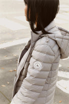 Women’s insulated hooded parka in latte, designed for warmth and comfort in South Africa’s winter season — Latte Classic Parka™