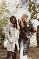 Women’s insulated ultra-length hooded parka in midnight black, designed for extra warmth and comfort in South Africa’s winter season — Midnight Ultra Parka™