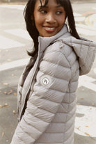 Women’s insulated hooded parka in latte, designed for warmth and comfort in South Africa’s winter season — Latte Classic Parka™